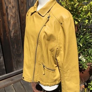 Yellow leather-like motorcycle jacket.